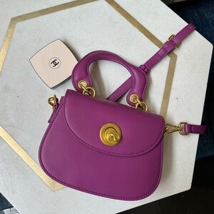 Purple bag with shoulder strap
